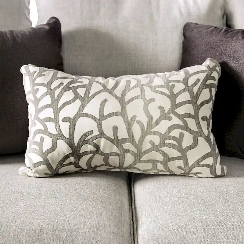 A light gray fabric upholstered sofa with a blue-toned transition style, adorned with rivets and featuring cushions.